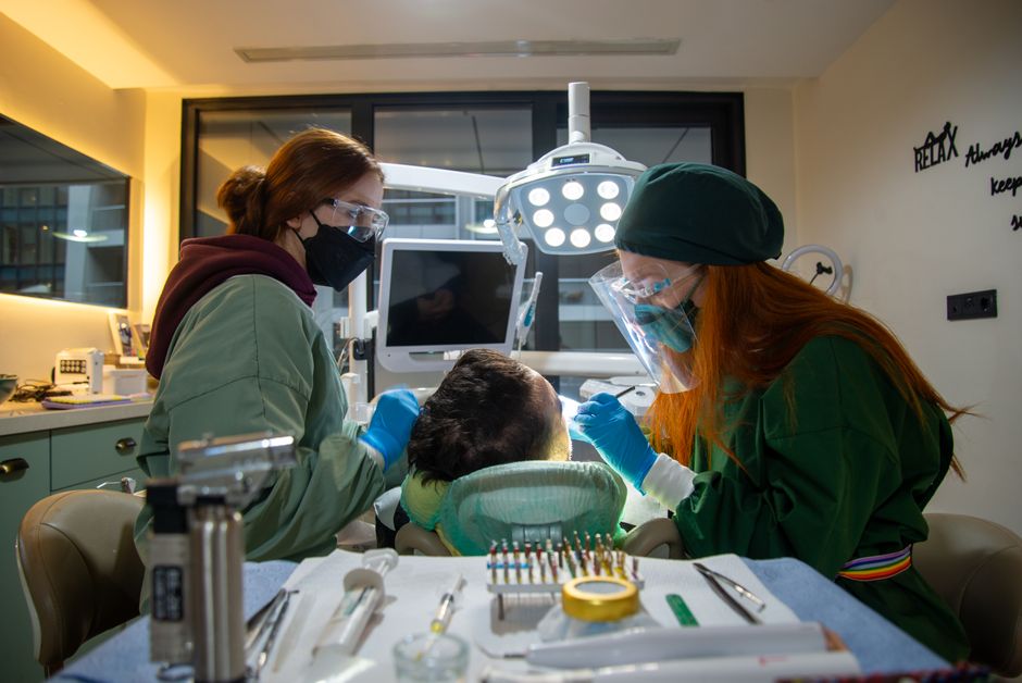 Dentist explaining the best dental insurance for implants to a patient