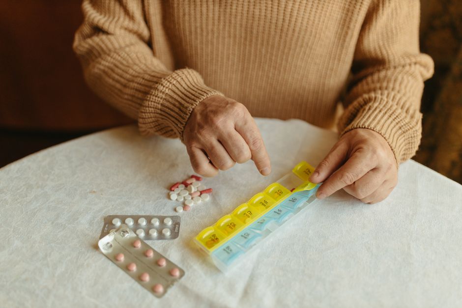 Senior picking up medication under Medicare Part D plans