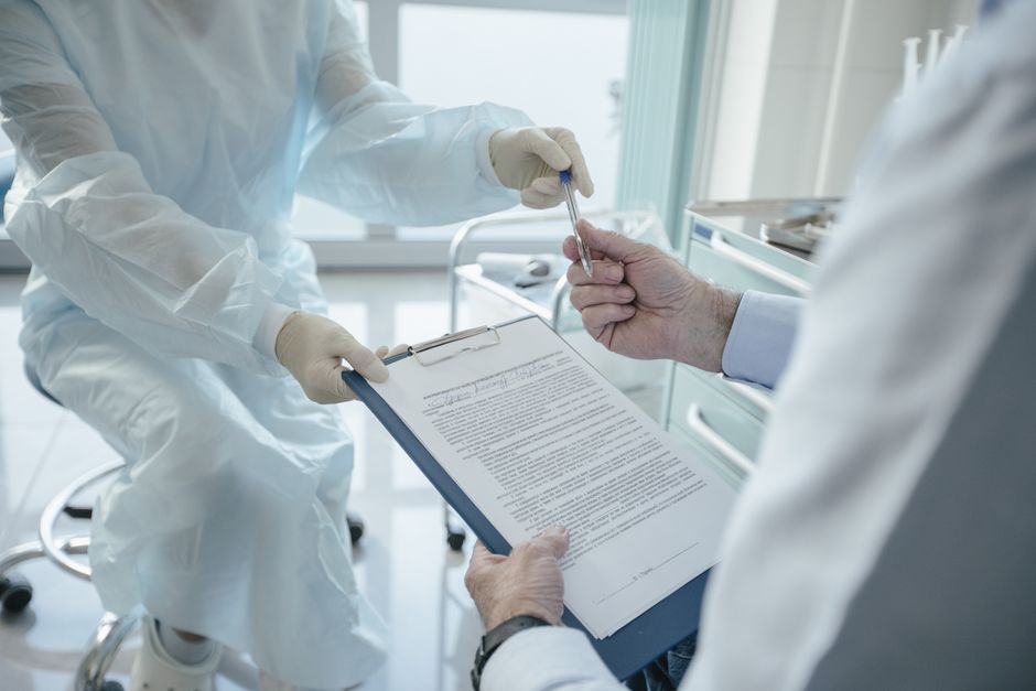 Reviewing COBRA health insurance paperwork after leaving a job